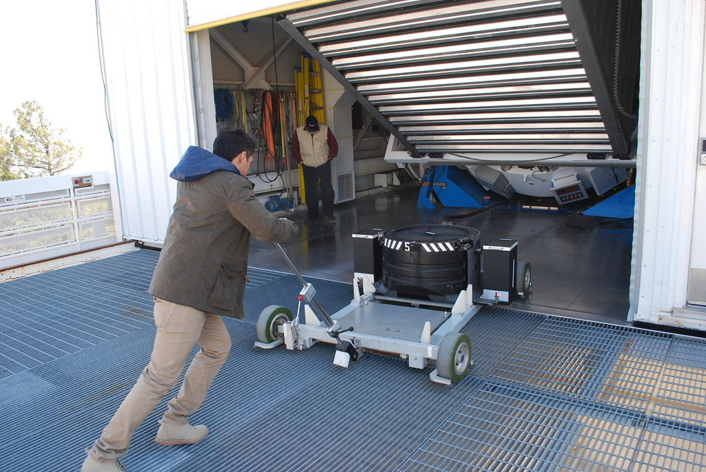Daniel pushes a cartridge to the telescope
