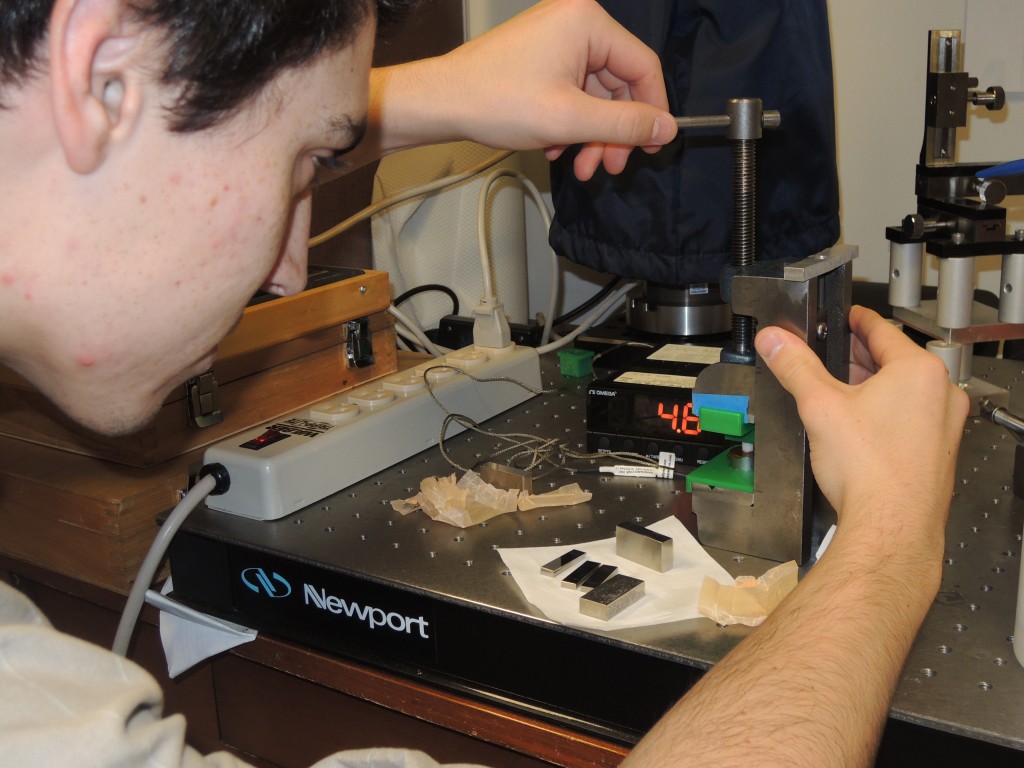 Matt Hall (UVa) is seen here testing the spring constants of individual spring plungers. As with every small part of the build, it is dealt with meticulously and thoroughly so that the completed spectrograph works at this highest level possible.