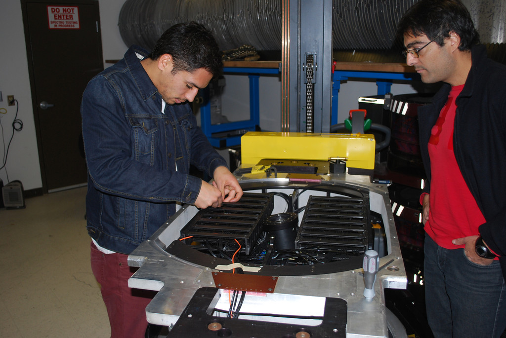 Daniel (left), Mario (right) explore the internal configuration of an APOGEE fiber optic cartridge