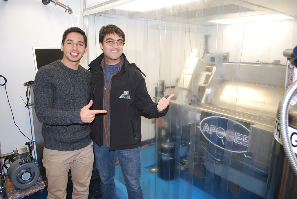 Daniel and Mario in front of the APOGEE instrument